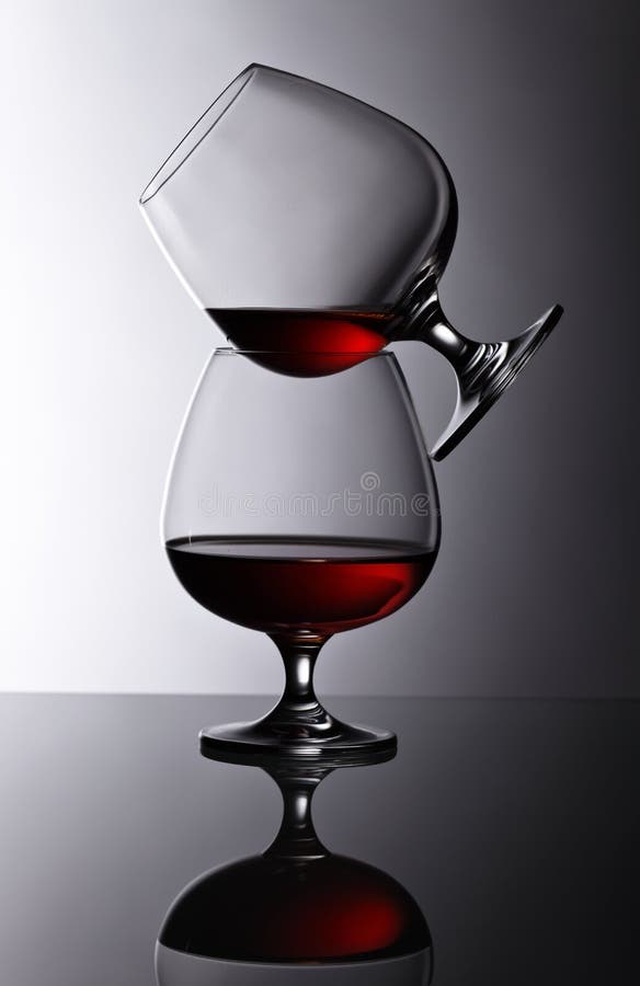 Two Snifters Of Brandy On Glass Table Stock Image Image of snifter
