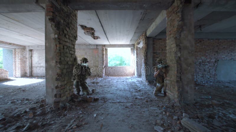 Two soldiers entering ruined building
