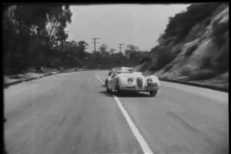 Two sports cars trying to overtake each other during race