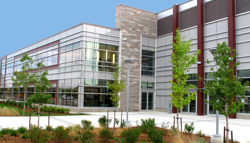 Modern two story commercial building with landscaping.