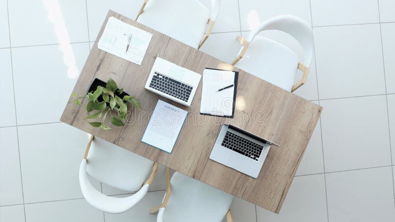 Two successful smiling businessmen are working on a laptop. view from above royalty free stock photography