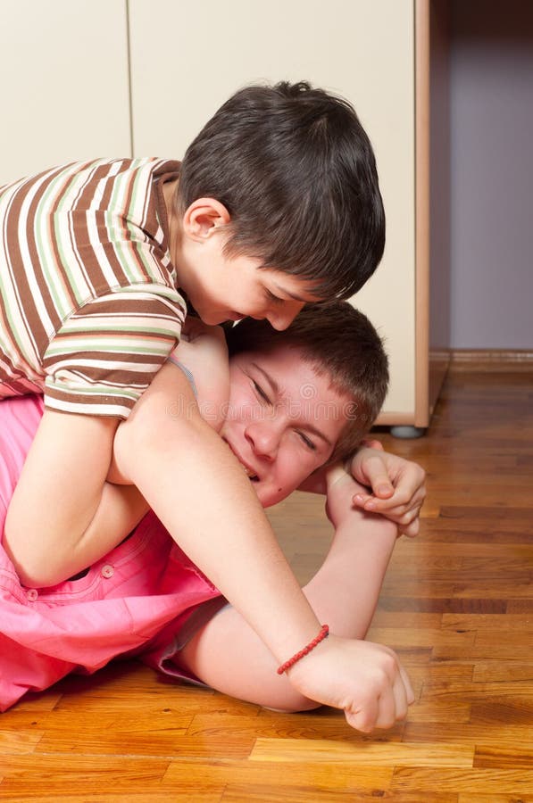 Two teenage boys wrestling