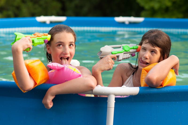 Two teenage girls having fun in the pool