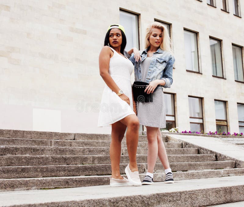 Two Teenage Girls Infront of University Building Smiling, Having Stock ...