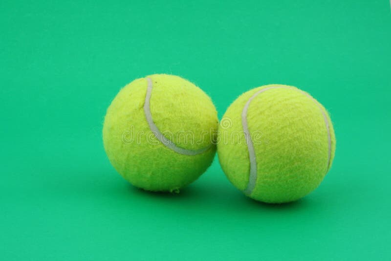 Two tennis balls on green stock photo. Image of match, soft 876636