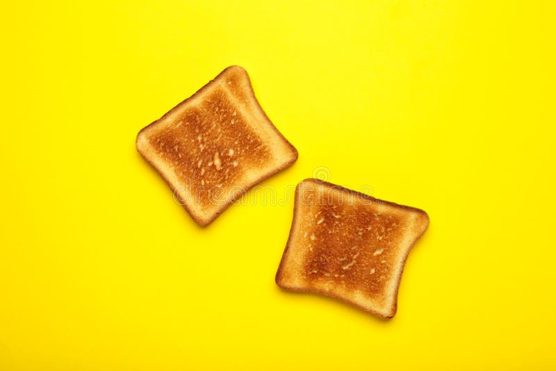 Two Toast Bread on a Bright Yellow Background. Top View, Flat Lay Stock