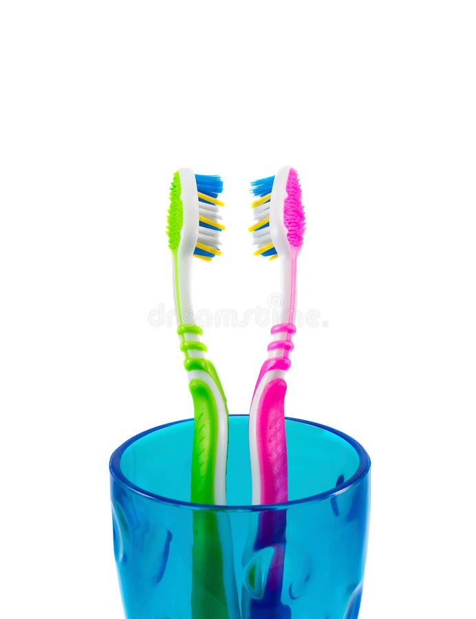 Two Toothbrushes And A Cup. Stock Image Image of beauty, breeziness