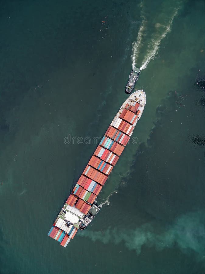 Two Tug Boat Towing Cargo Container in Warehouse Harbor at Thailand
