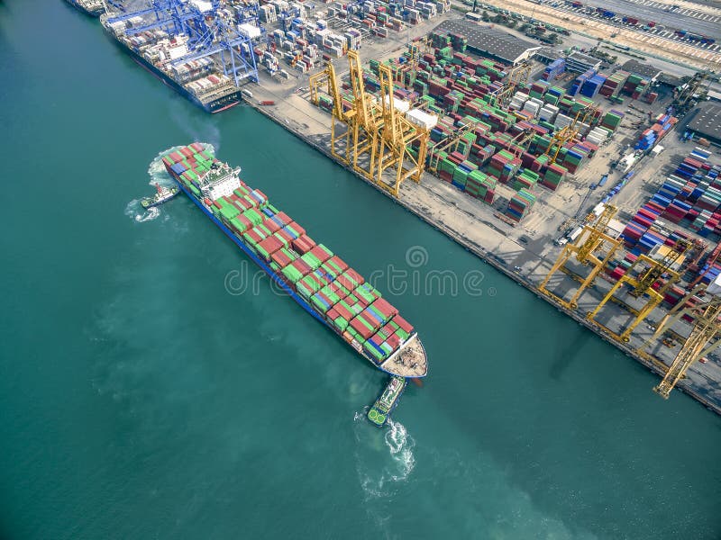 Two Tug Boat Towing Cargo Container in Warehouse Harbor at Thailand