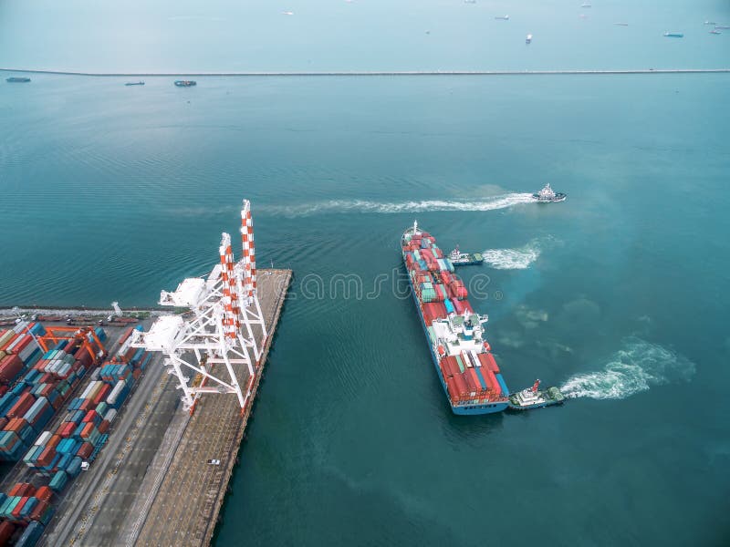 Two Tug Boat Towing Cargo Container in Warehouse Harbor at Thailand