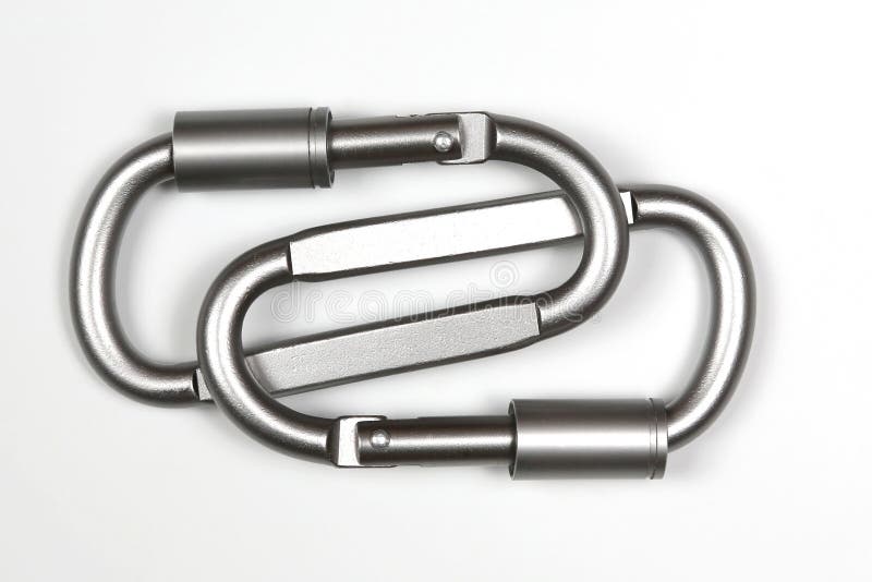 Two united grey climbing carabiner on a white background royalty free stock photo Two united grey climbing carabiner on a white background royalty free stock photo