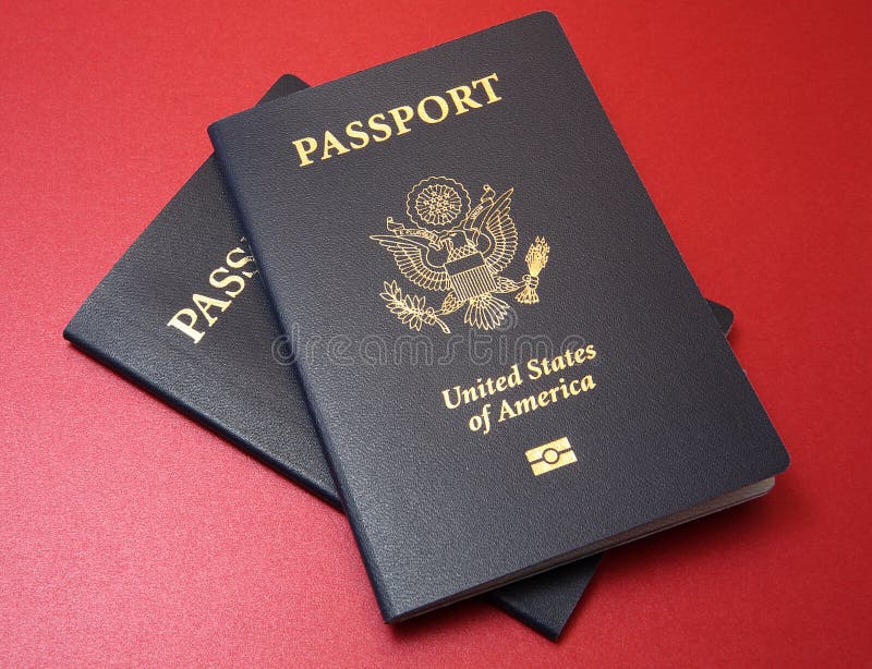 Two US Passports on Red Background royalty free stock images