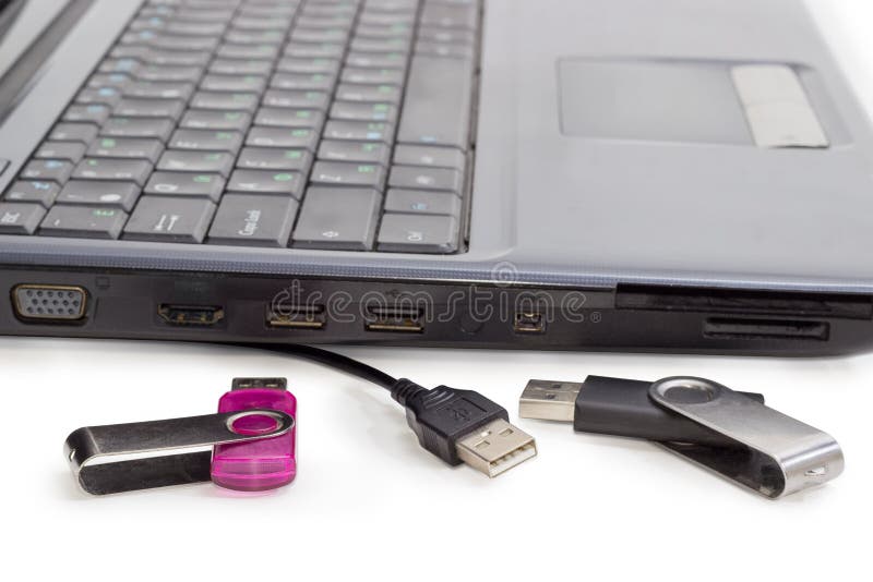 Two USB Flash Drives and USB Cable Against of Laptop Stock Photo Image of hardware, isolation