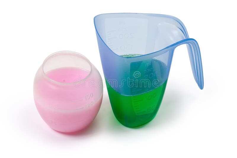 Liquid Laundry Detergent in Measuring Cup on a White Background