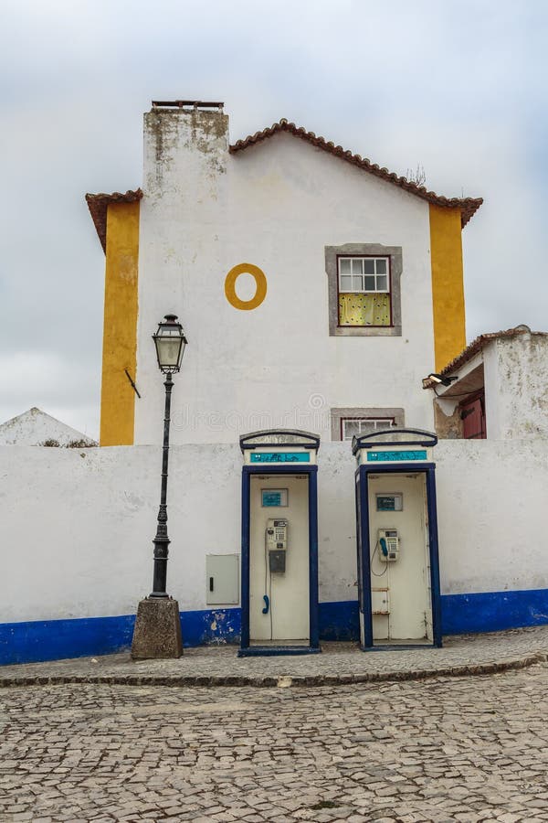 Two Vintage Blue Phone Call Boxes, an Old Lamp, an House and Cob