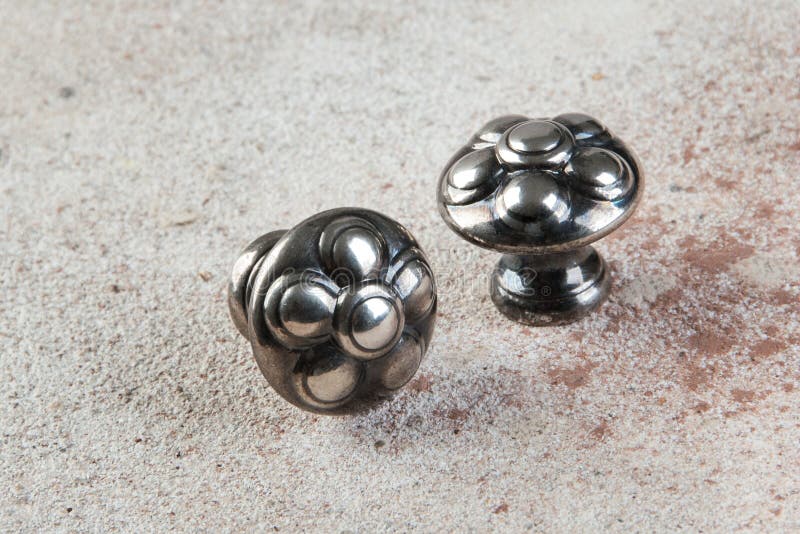 Two vintage metal drawer pull knobs stock photos