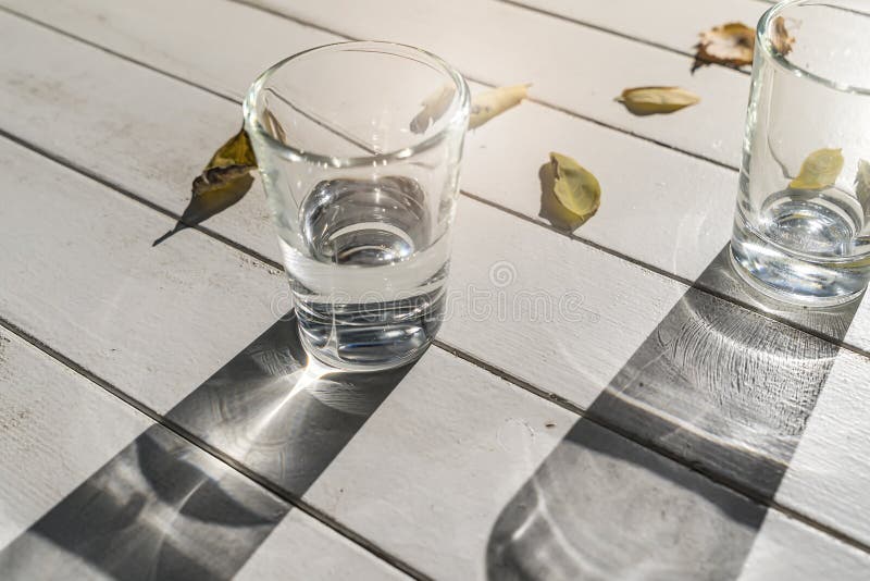 Two water glasses on a table