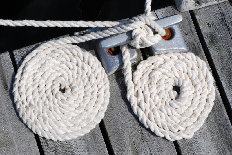 Two white boat ropes coiled up