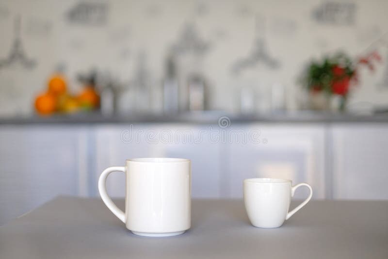 Two White Cups of Coffee on Kitchen Defocused Background Stock Photo