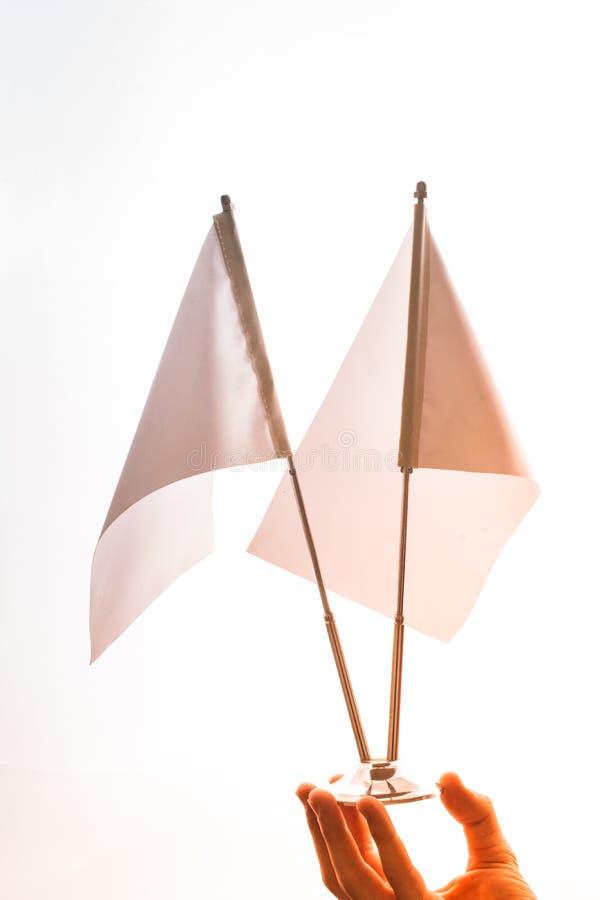 Two White Flags on a White Background in Display Stock Image Image of