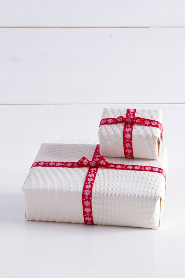 Two white gift boxes with polka dots. With red ribbon vertical shot royalty free stock photos Two white gift boxes with polka dots. With red ribbon vertical shot royalty free stock photos