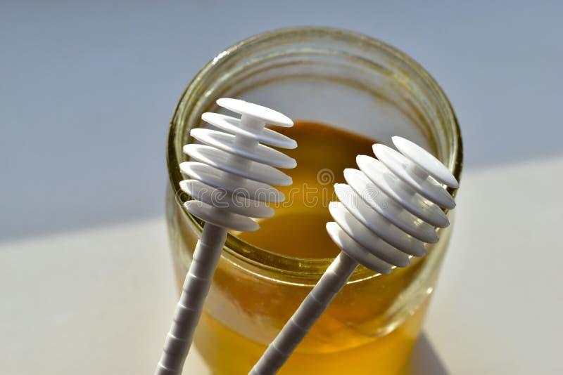 Two White Plastic Honey Spoons Dipped in Nectar Stock Photo Image of