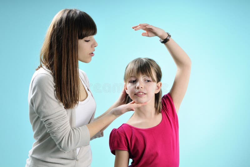 Two white teens exercising dance