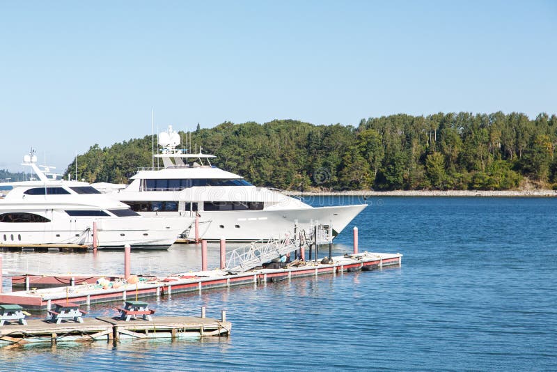 two yachts leave from harbour h