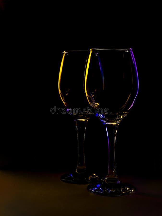 Two wine glasses, backlit still life. stock photography