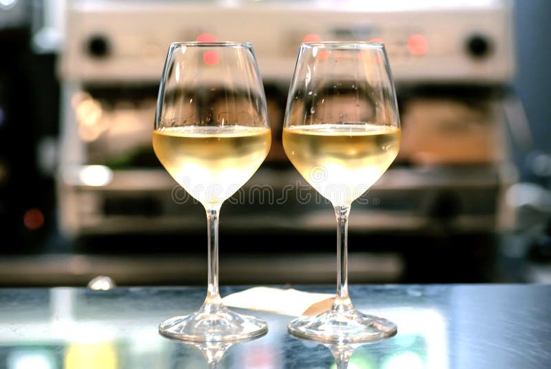 Two wine glasses in bar. Date time for loving people inside restaurant or cafe stock image