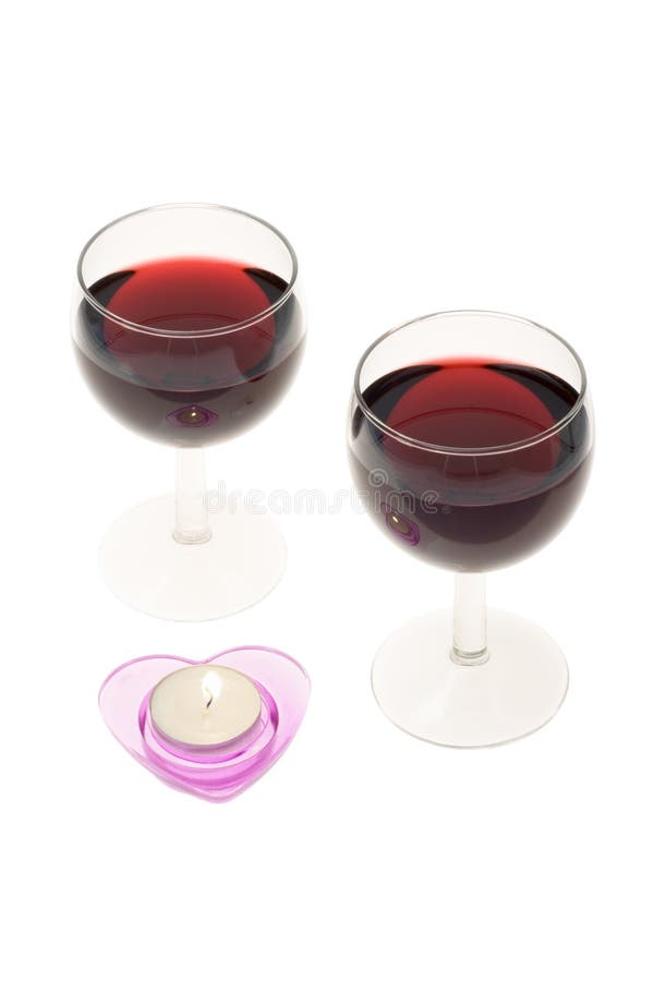 Two wine-glasses and candle stock image