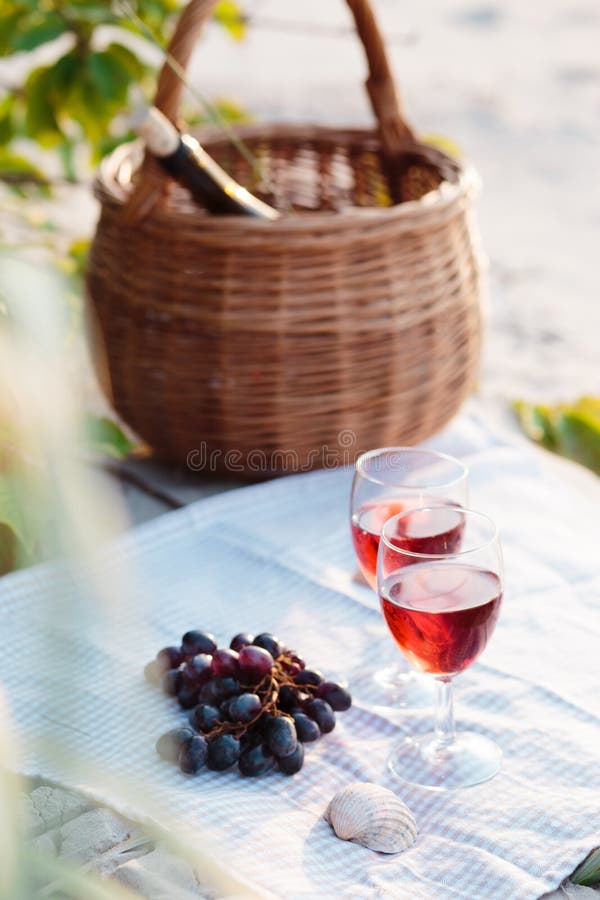 Two Wine Glasses, Grapes, Wicker Basket on Beach Stock Image Image of
