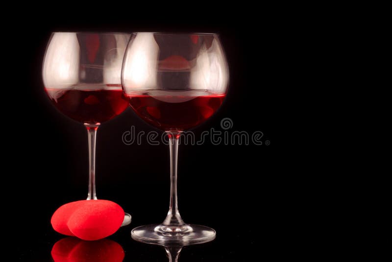 Two wine glasses and a heart royalty free stock images