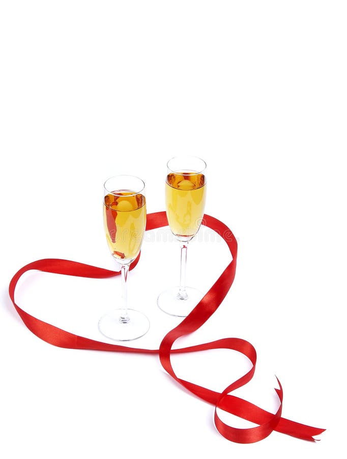 Two wine glasses and red satiny tape stock photo