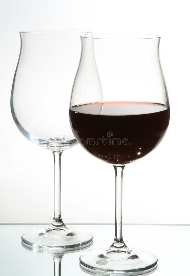 Two wine glasses with red wine royalty free stock image