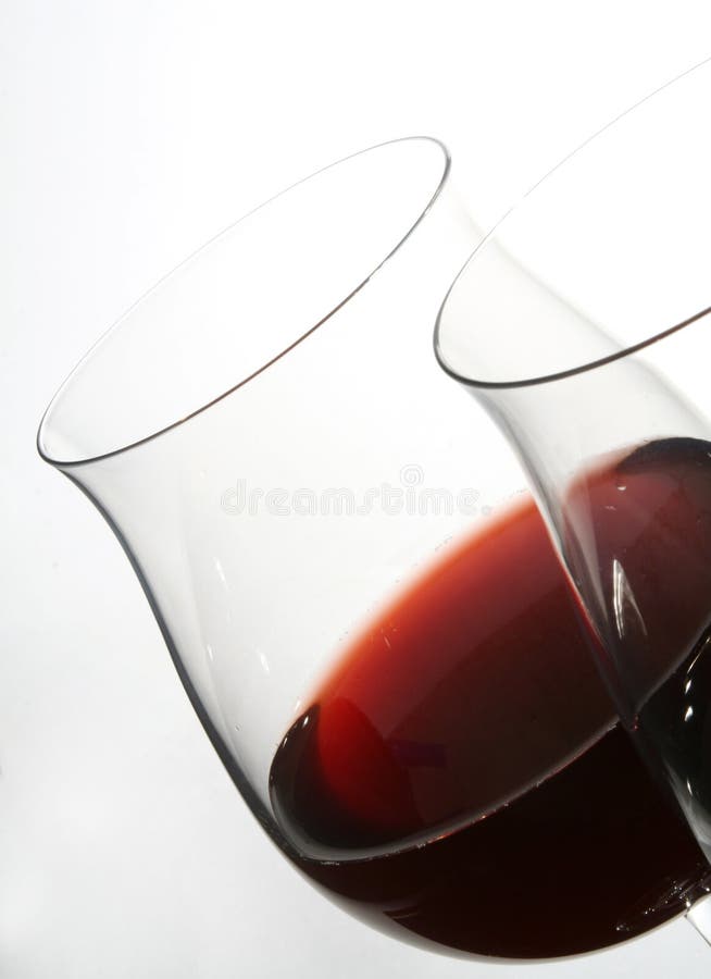 Two wine glasses with red wine stock photos