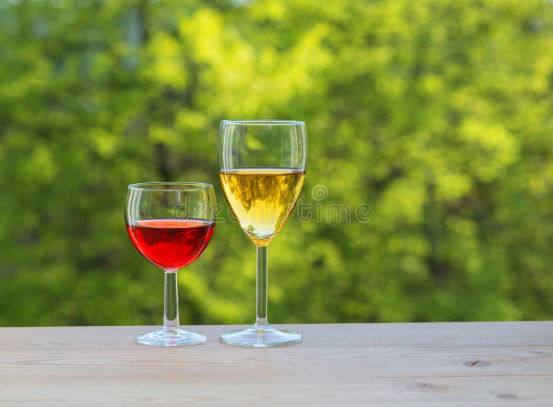 Two wine glasses on table