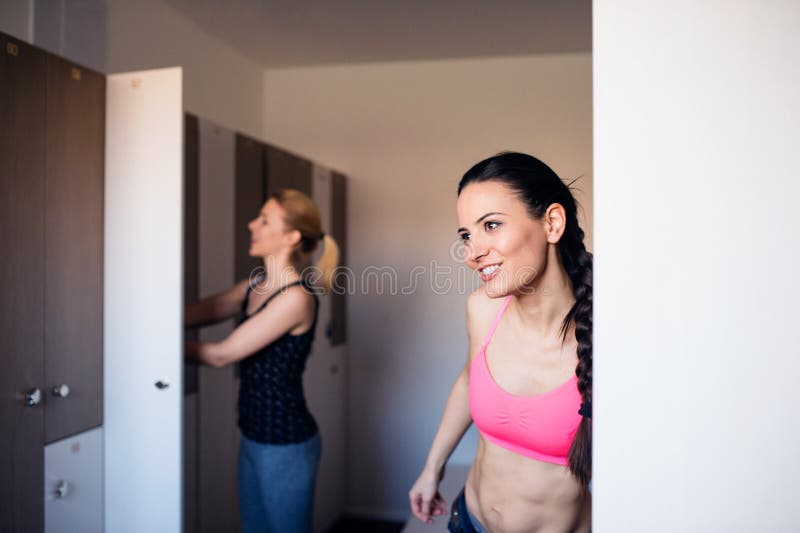 Naked girls in the locker room of the fitness club.