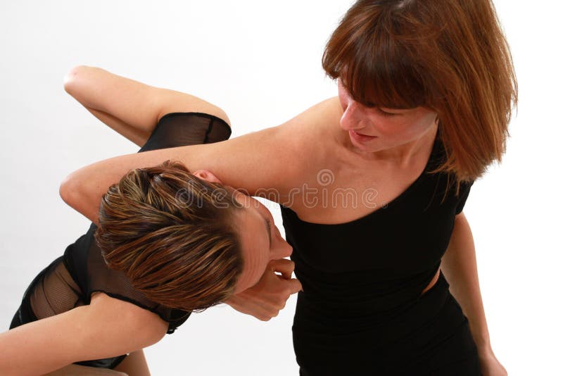 Two woman fighting stock photo