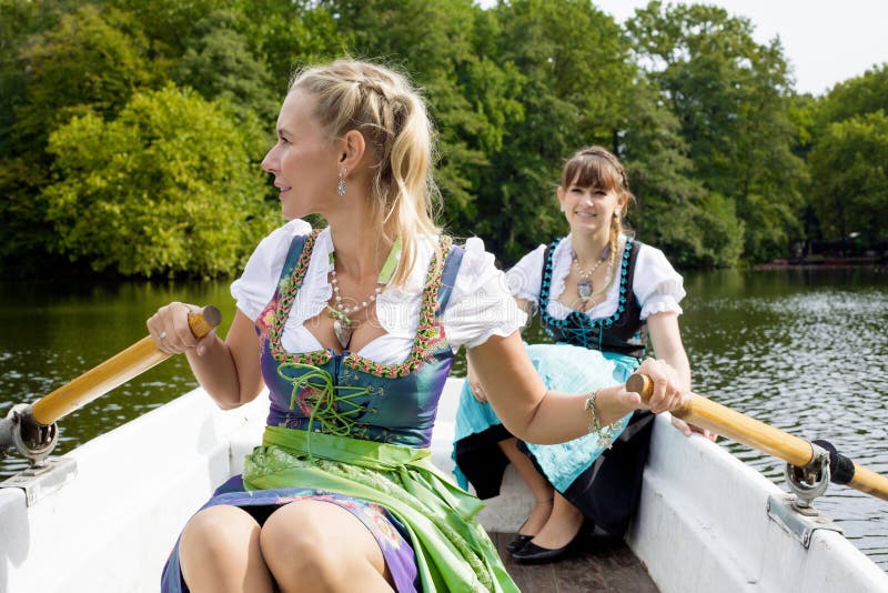 Two woman in a rowing boat stock image. Image of happy - 45365355