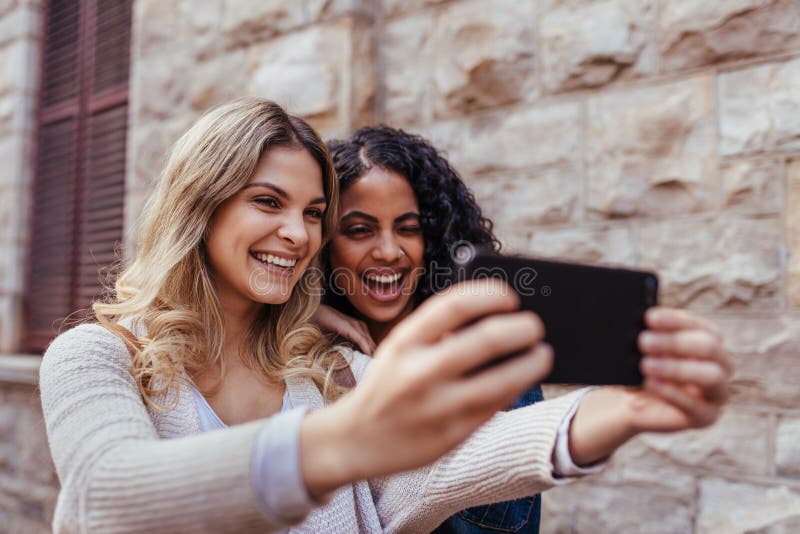 Two Women Clicking a Selfie Outdoors Stock Image - Image of tourism ...