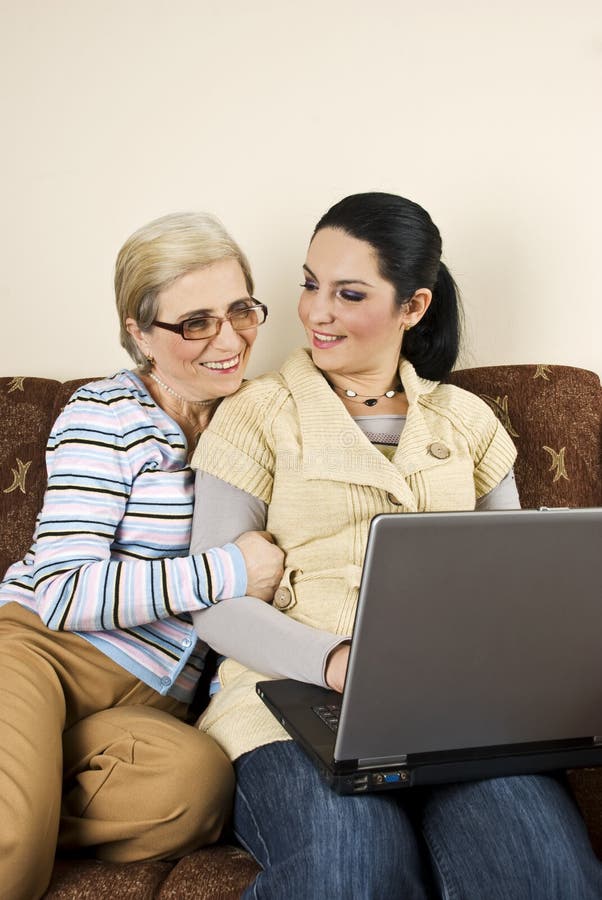 Two women conversation and work on laptop