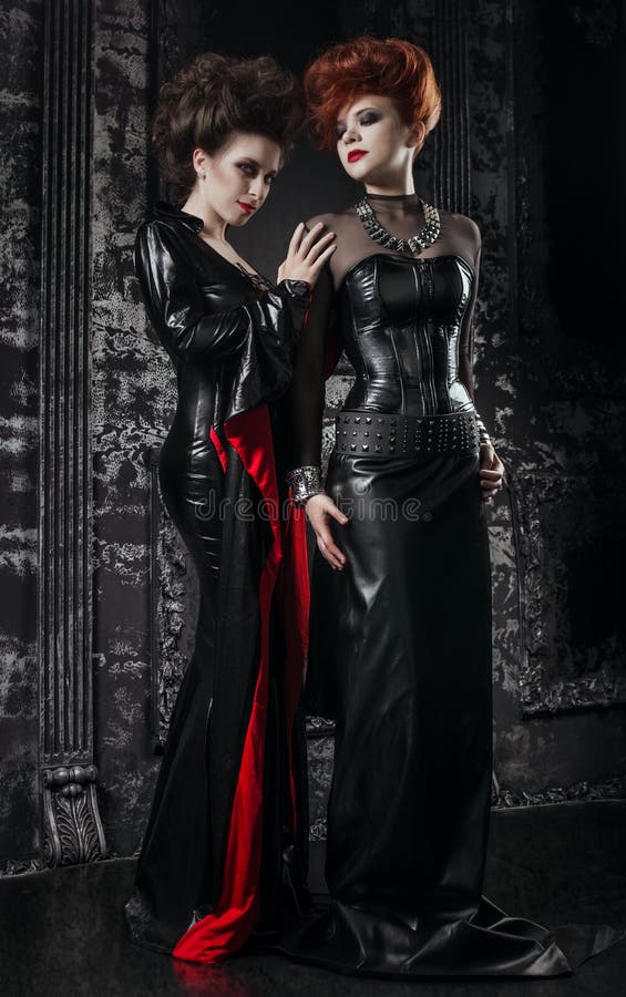 Two women in fetish costumes stock photography Two women in fetish costumes stock photography