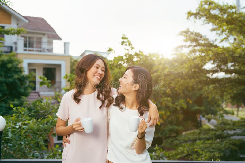 Two Women Relaxing Rooftop Garden Drinking Coffee Stock Photos Free