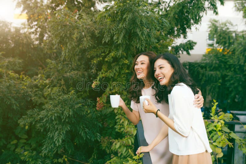 Two Women Relaxing Rooftop Garden Drinking Coffee Stock Photos Free