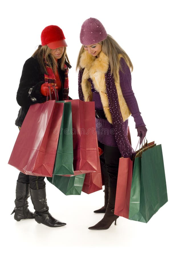 Two young women on shopping. Front view, isolated on white background. Two young women on shopping. Front view, isolated on white background.