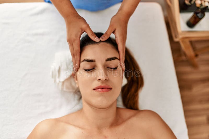 Two Women Therapist And Patient Having Facial Massage Session At Beauty 