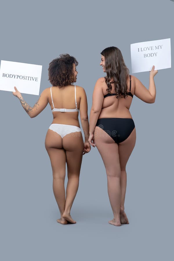 https://thumbs.dreamstime.com/b/two-women-underwear-posters-standing-back-body-positive-different-stature-physique-white-black-holding-up-hand-177669887.jpg