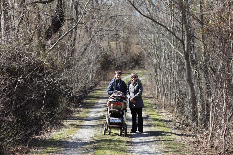 Two women are walking in park