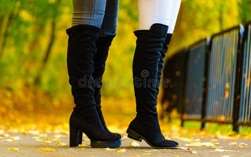 Two Women Wearing Black Knee High Boots Stock Photo - Image of shoes ...